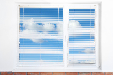 Image of Beautiful view on blue sky with clouds through window