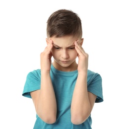 Little boy suffering from headache on white background