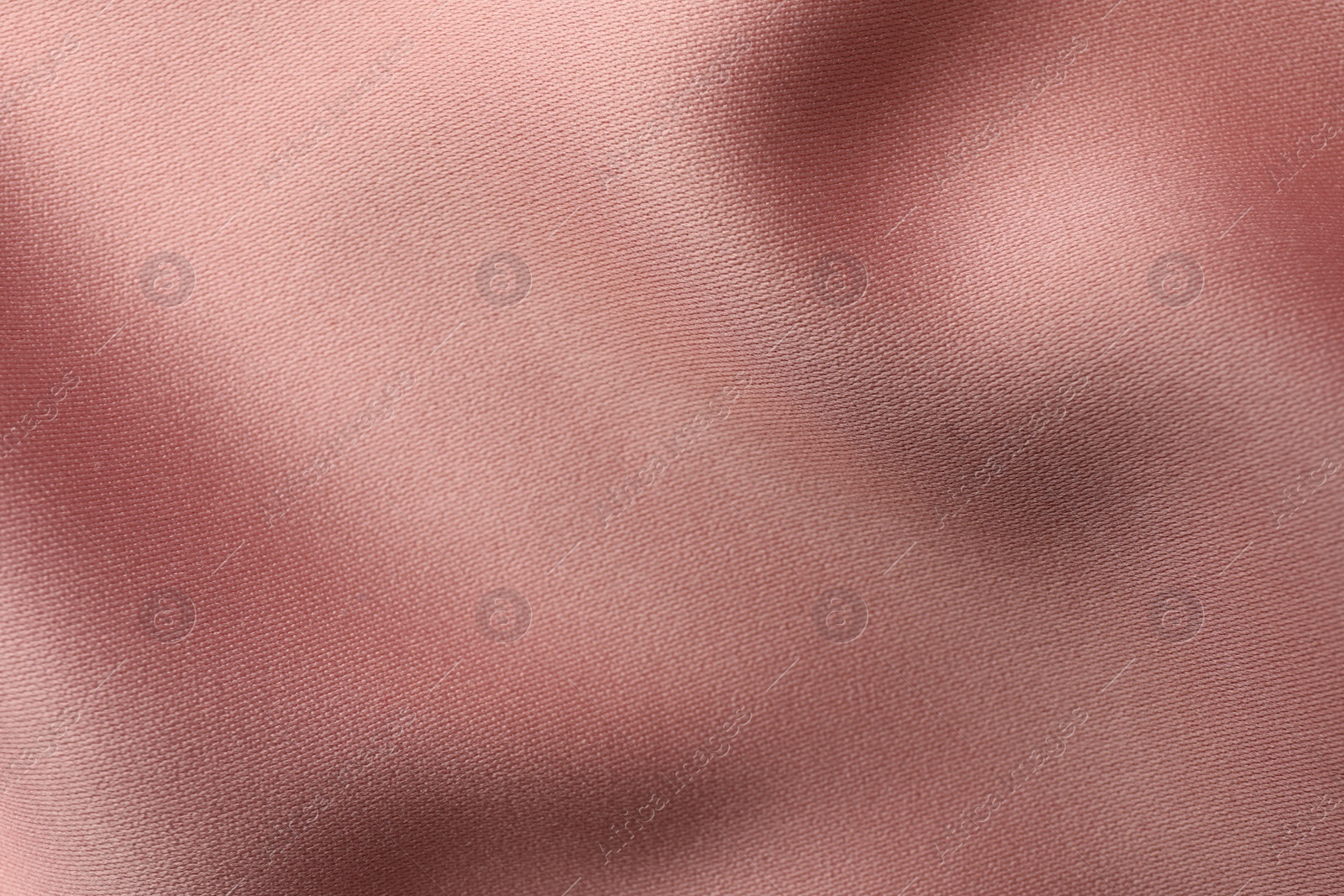 Photo of Texture of pink silk fabric as background, top view