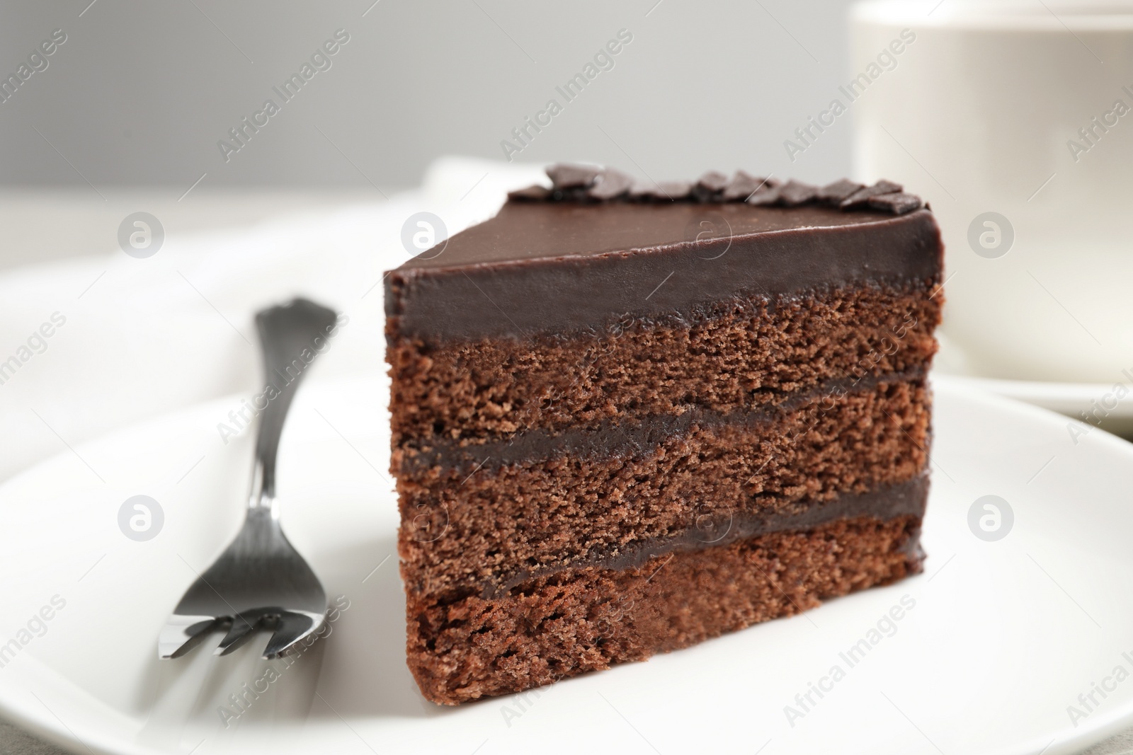 Photo of Piece of tasty chocolate cake served on plate