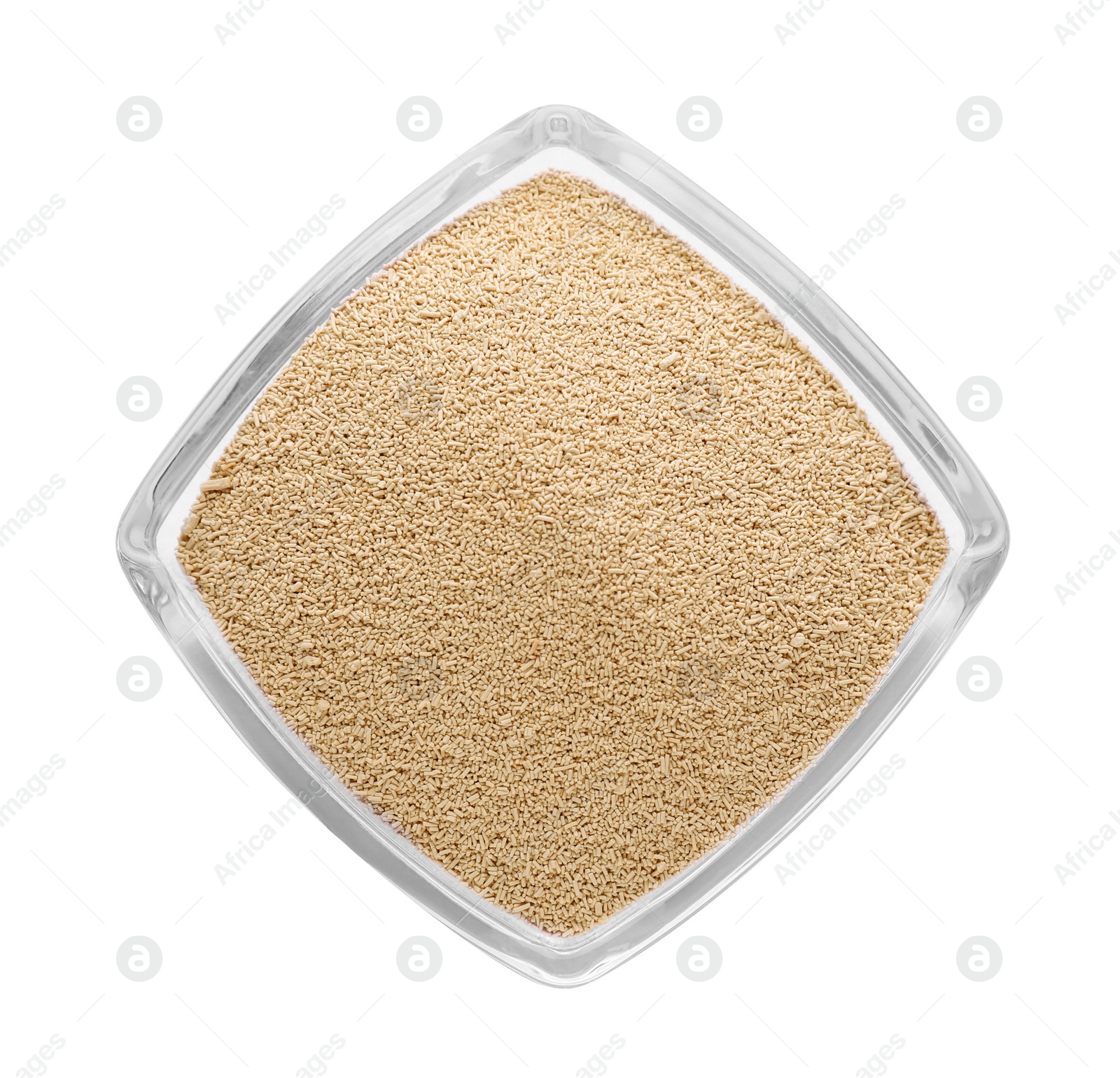 Photo of Bowl of active dry yeast isolated on white, top view
