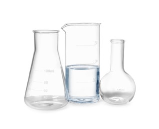 Photo of Glass flasks and beaker with water isolated on white