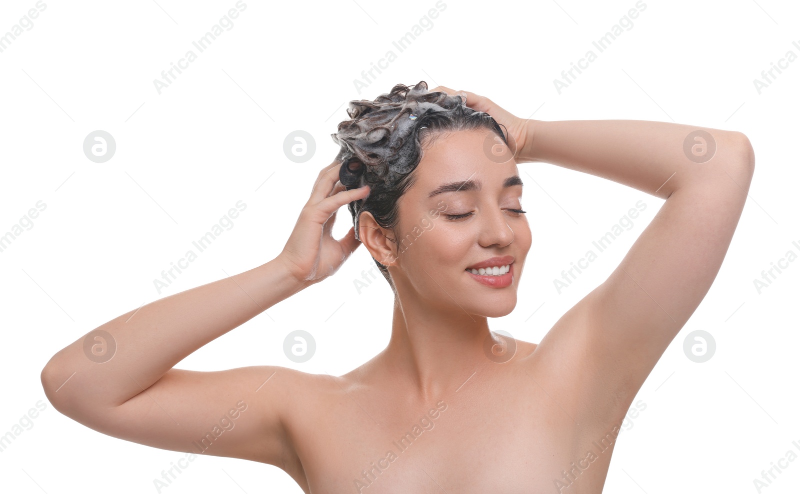 Photo of Beautiful happy woman washing hair on white background