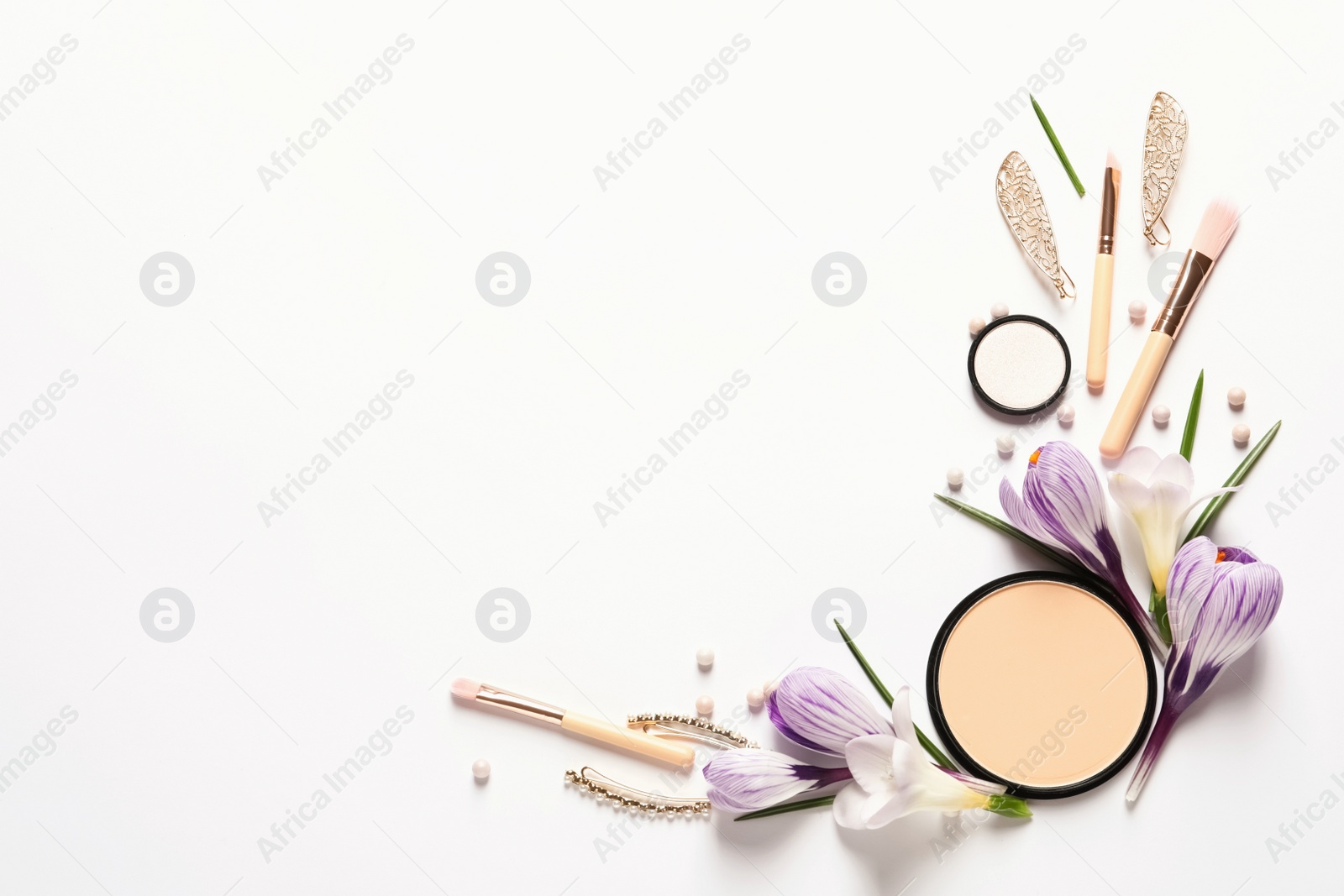 Photo of Different makeup products and flowers on white background, top view with space for text