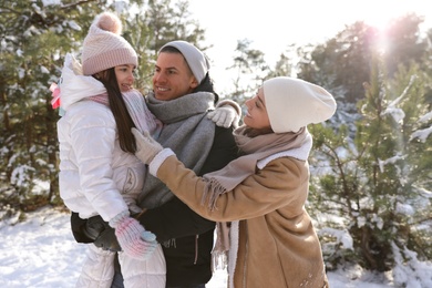 Photo of Happy family outdoors on winter day. Christmas vacation
