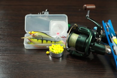 Fishing tackle on dark wooden background, closeup