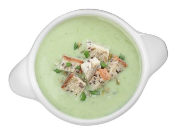 Delicious asparagus soup with croutons and green onion on white background, top view