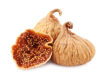 Many tasty dried figs isolated on white