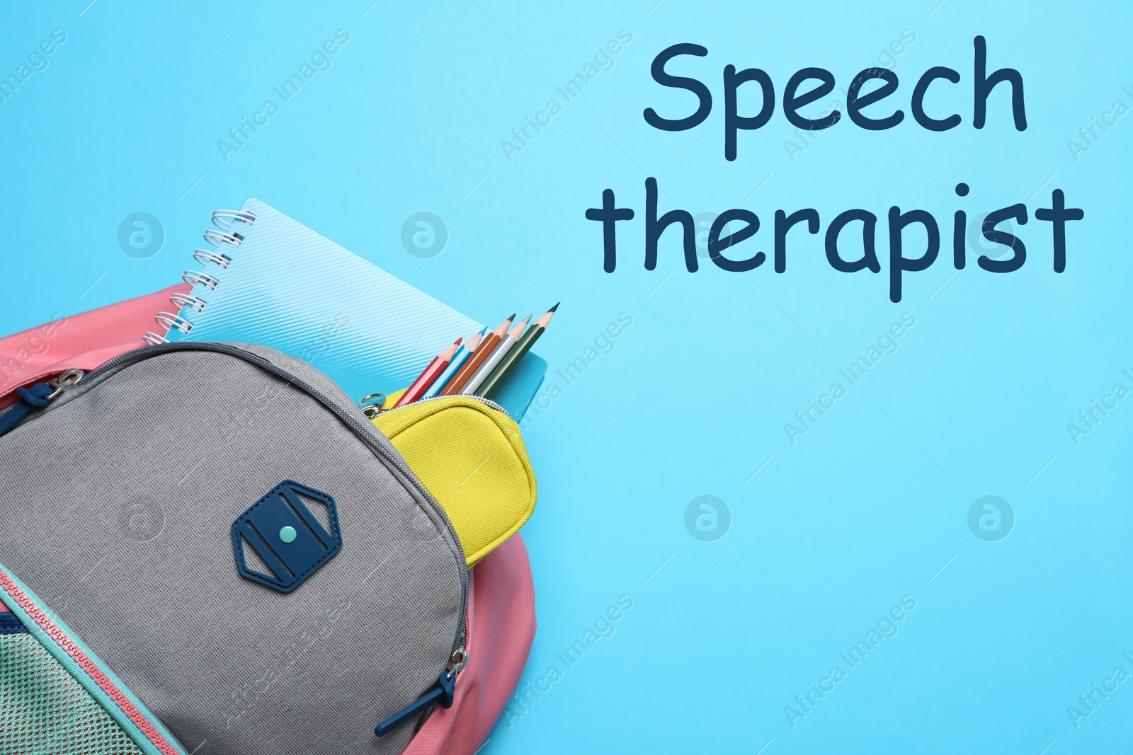 Image of Stylish backpack with different school supplies and text Speech Therapist on light blue background