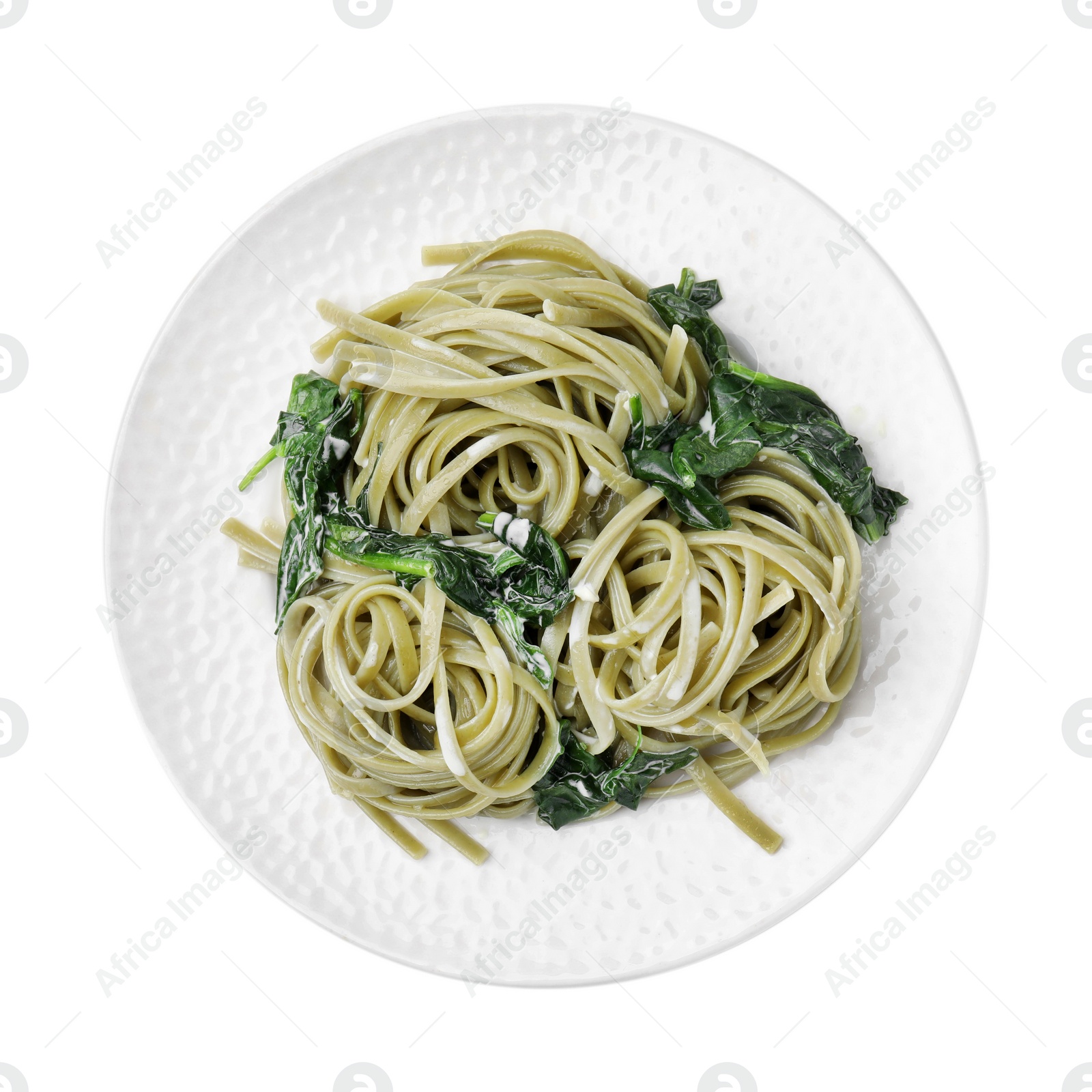 Photo of Tasty pasta with spinach and sauce isolated on white, top view