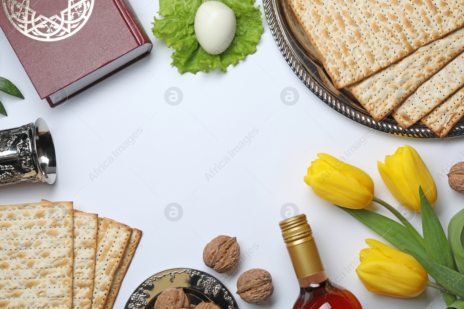 Photo of Flat lay composition with symbolic Passover (Pesach) items on white background, space for text