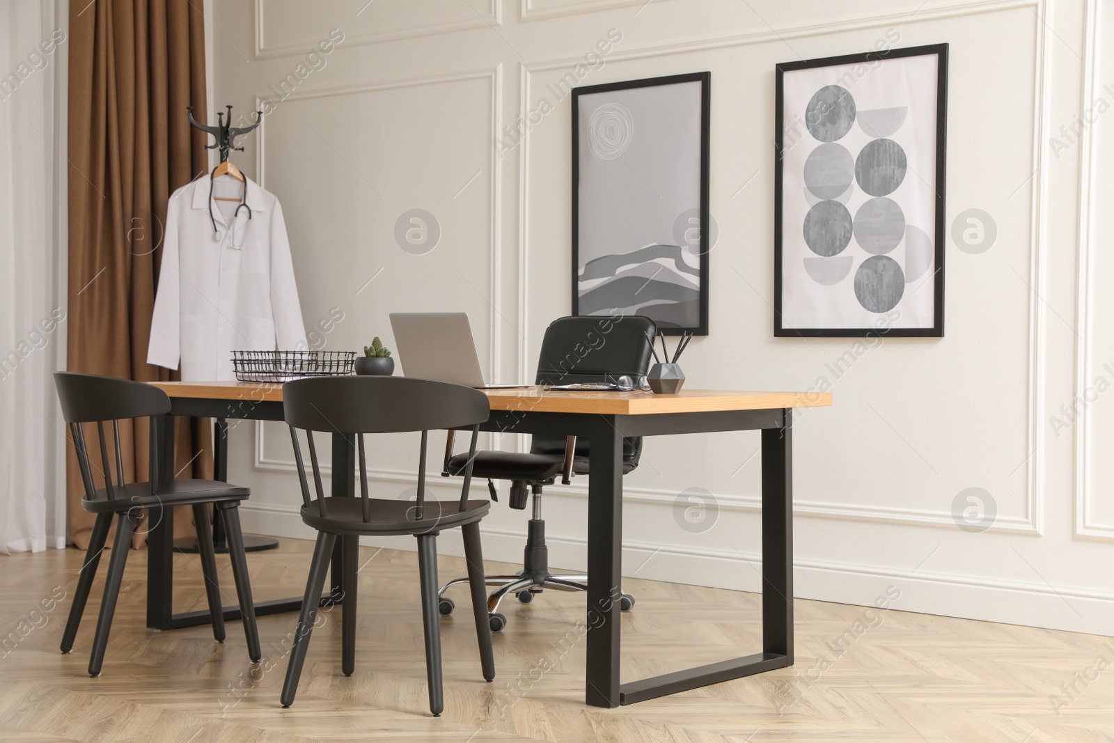 Photo of Modern medical office interior with doctor's workplace and chairs