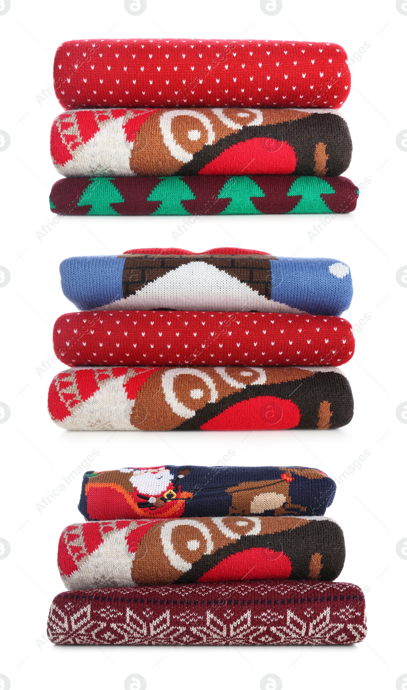 Image of Set with stacks of folded Christmas sweaters on white background