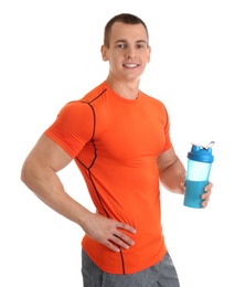 Athletic young man with protein shake on white background