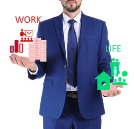 Businessman showing balance between life and work on white background, closeup