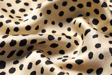 Photo of Texture of polka dot fabric as background, closeup