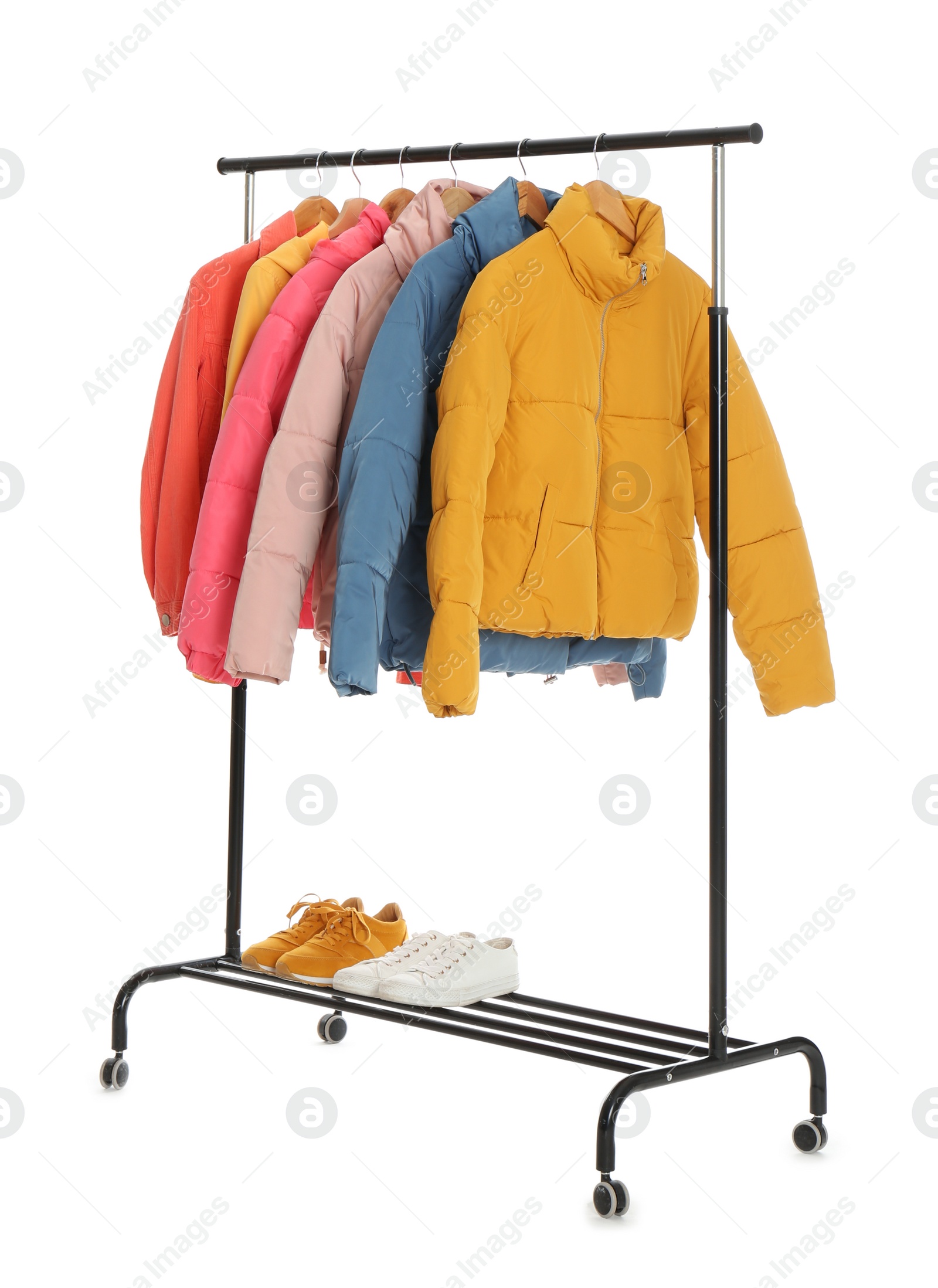 Photo of Rack with stylish jackets and shoes isolated on white