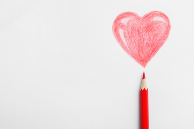 Photo of Drawing of heart and red pencil on white background, top view
