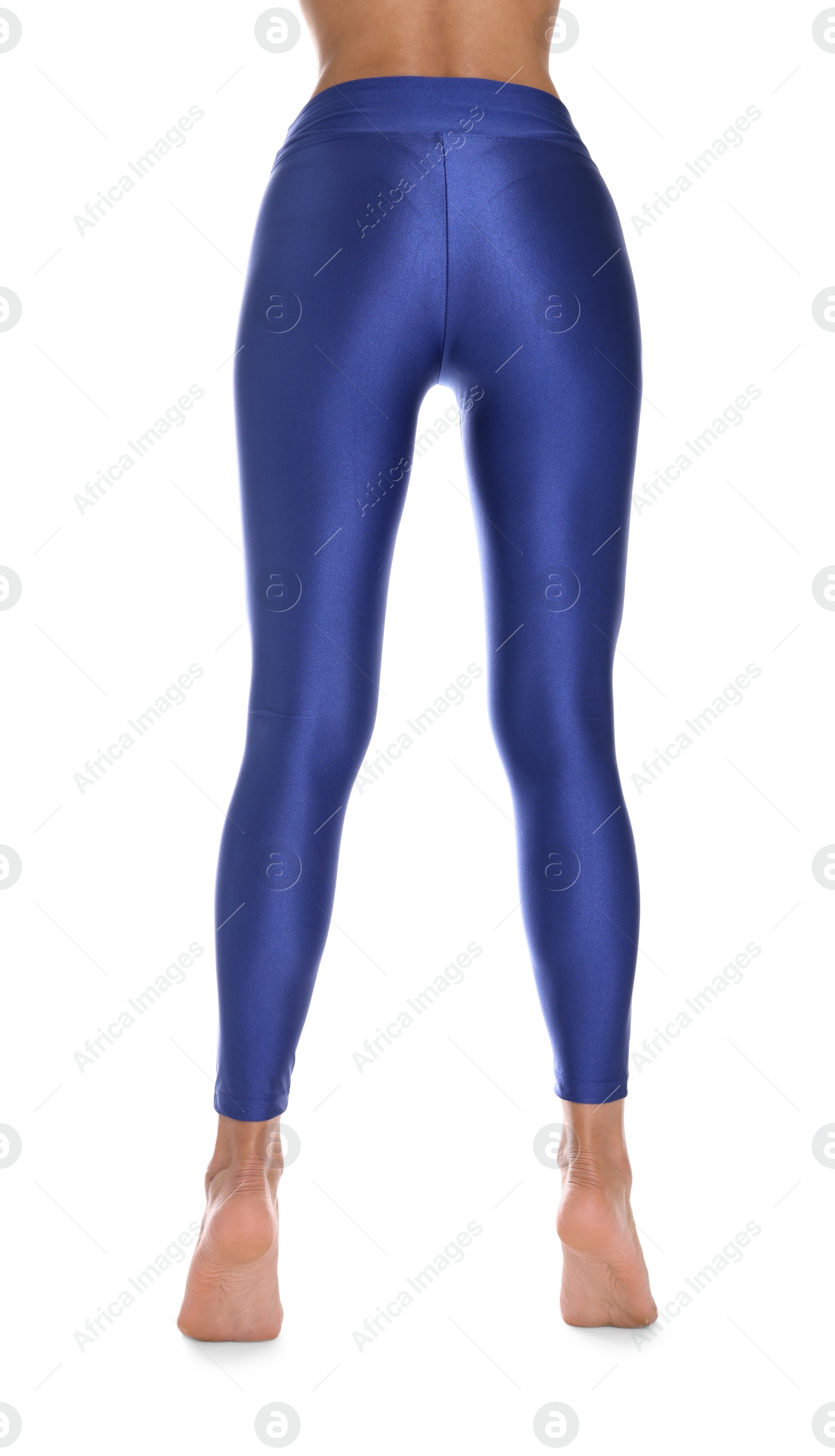 Photo of Woman with beautiful long legs wearing blue leggings on white background, closeup