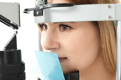 Photo of Woman visiting ophthalmologist, closeup
