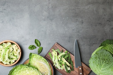 Photo of Flat lay composition with savoy cabbage and space for text on grey background