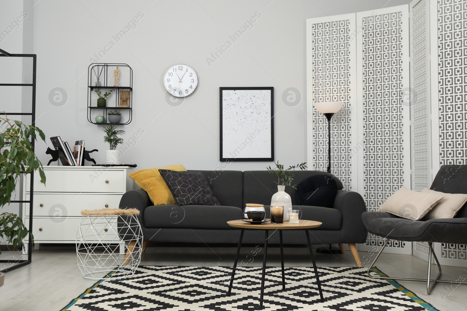 Photo of Living room interior with comfortable furniture and decorative elements