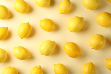 Flat lay composition with fresh ripe lemons on color background