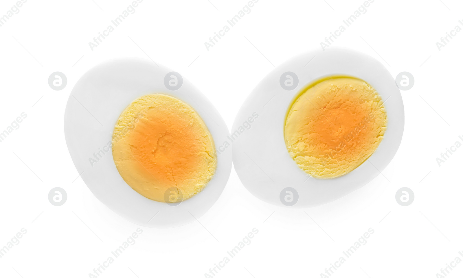 Photo of Halves of fresh hard boiled egg on white background, top view