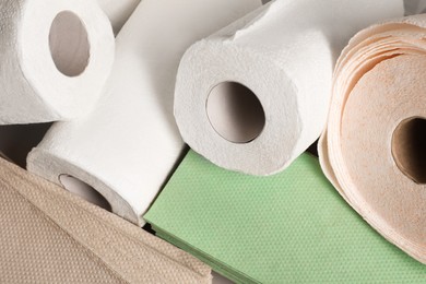 Photo of Paper towels and napkins as background, closeup