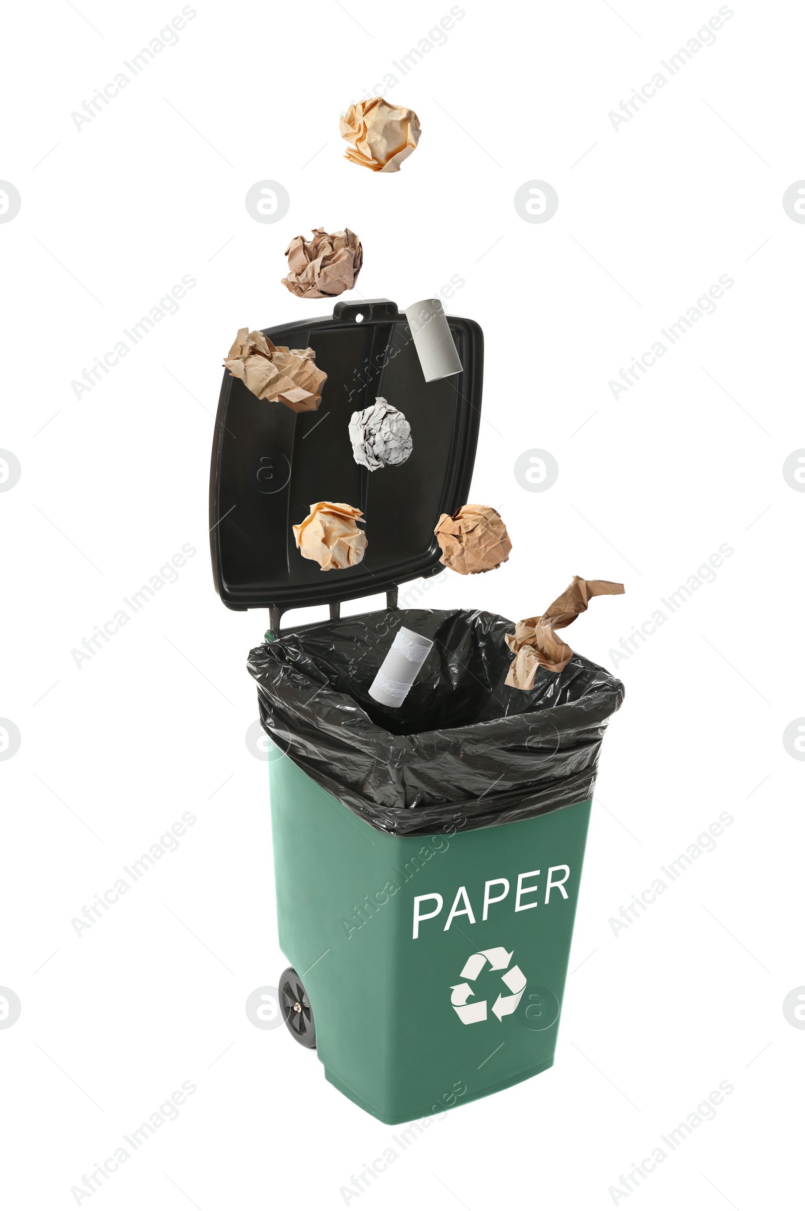 Image of Different paper garbage falling into trash bin. Waste management and recycling