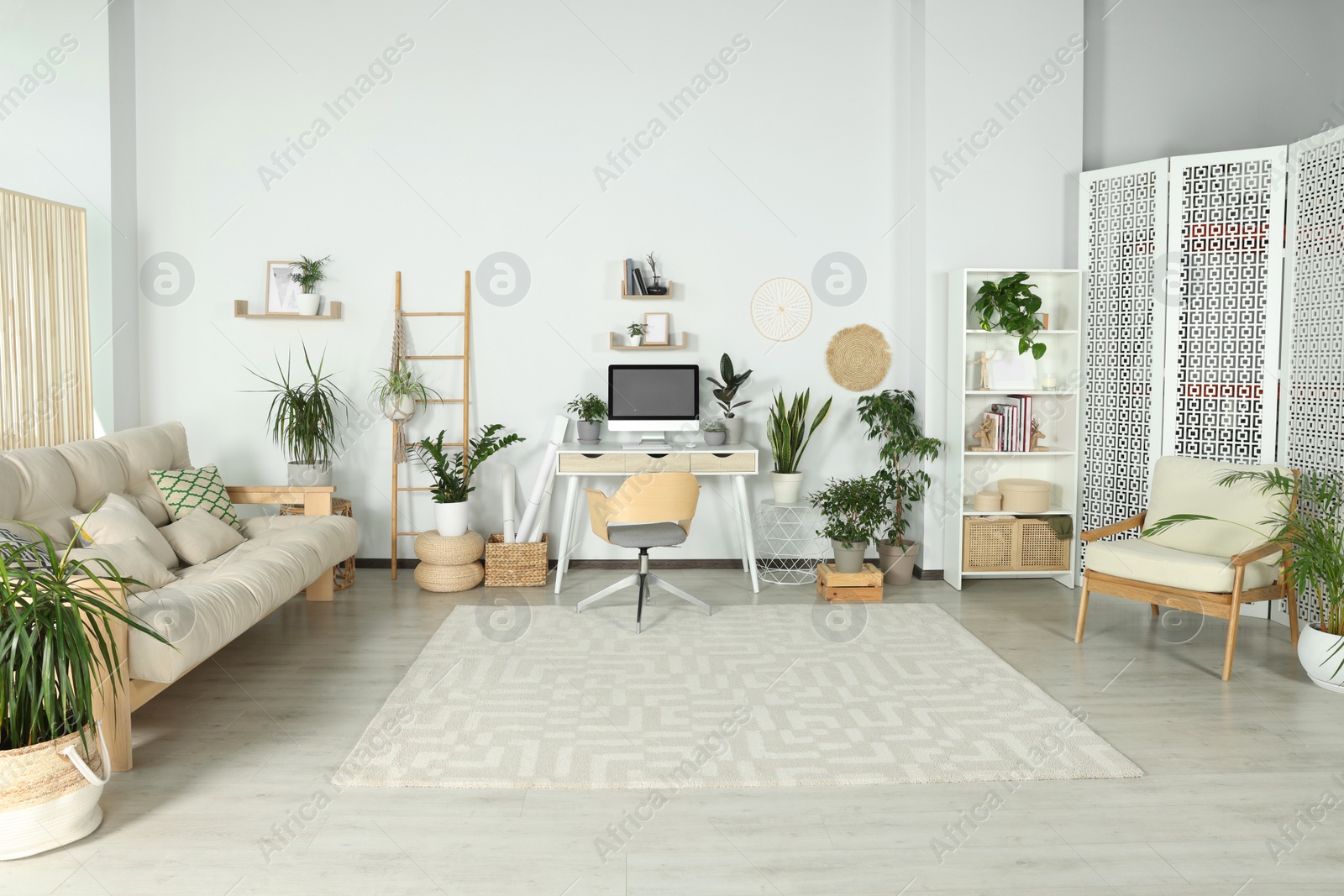 Photo of Stylish room interior with modern furniture and beautiful houseplants