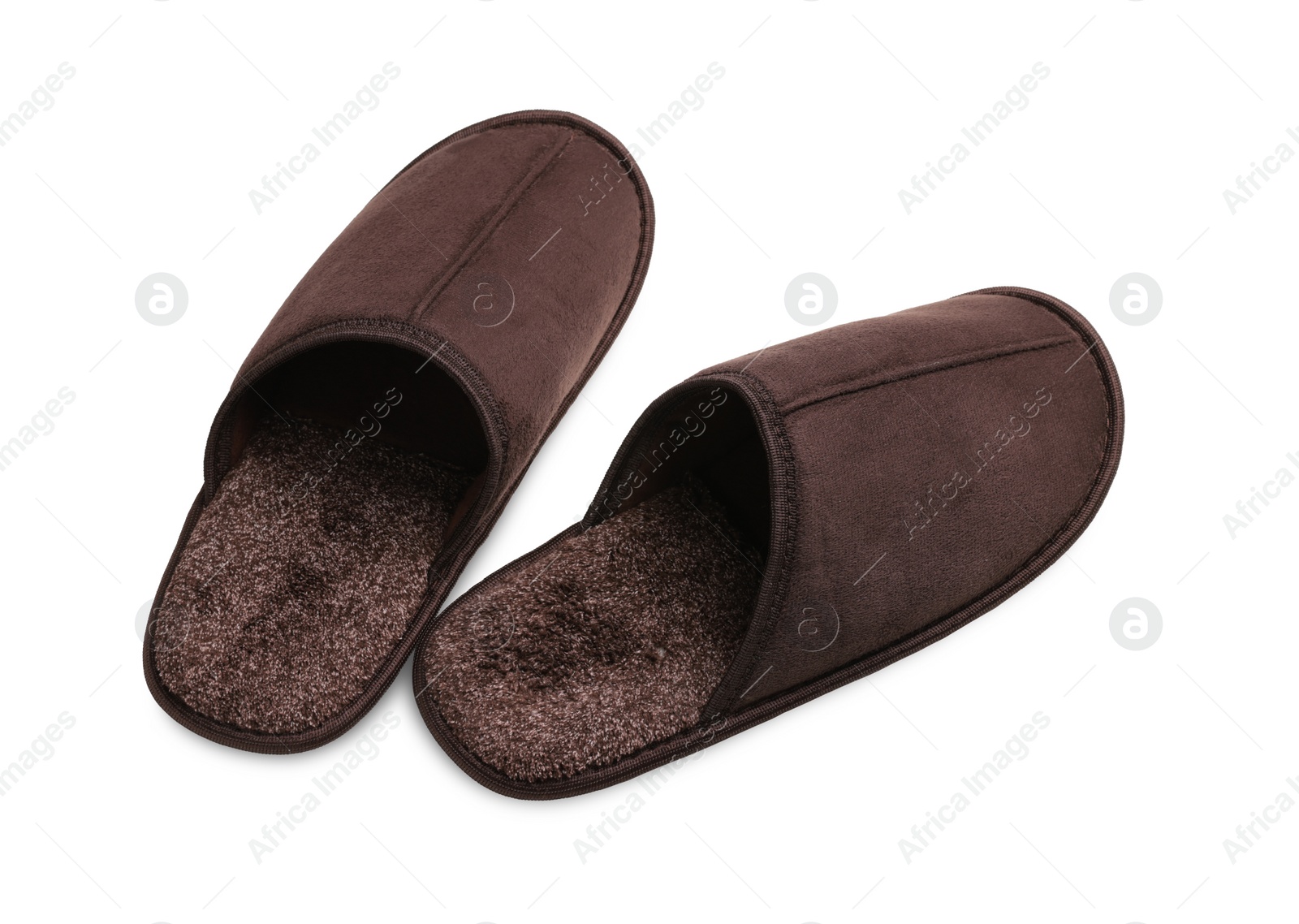 Photo of Pair of brown slippers on white background