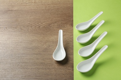 Photo of Miso soup spoons on table. Space for text