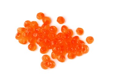 Photo of Pile of delicious red caviar isolated on white, top view