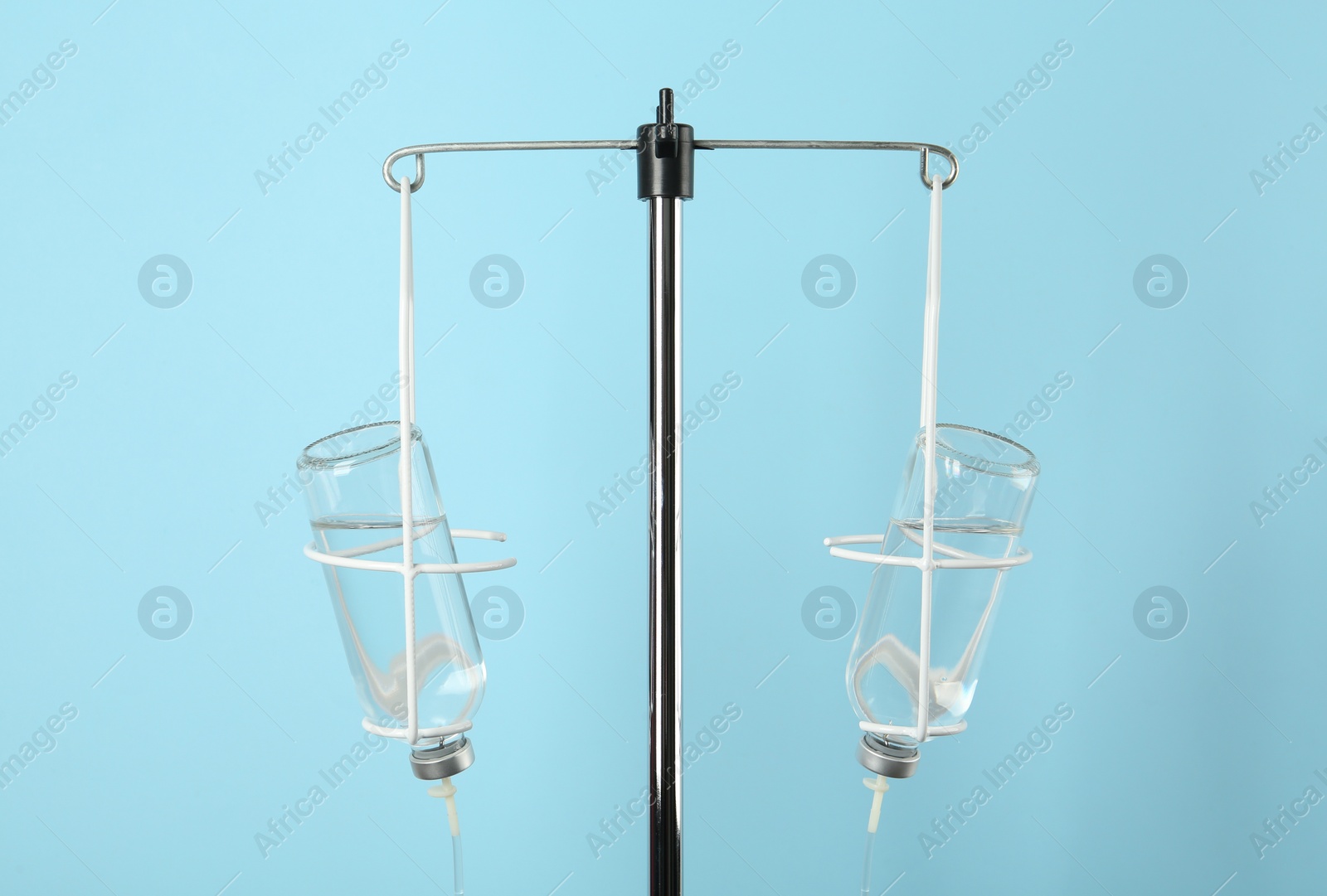 Photo of IV infusion set on light blue background