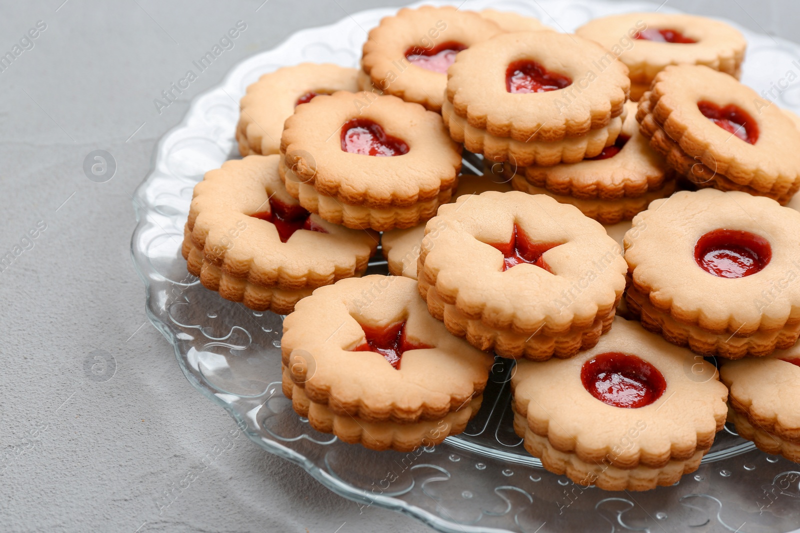 Photo of Traditional Christmas Linzer cookies with sweet jam on plate