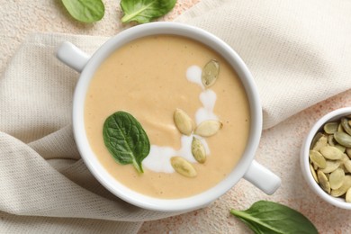 Photo of Healthy cream soup high in vegetable fats on color textured table, flat lay