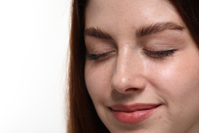 Portrait of beautiful woman with freckles on white background, closeup