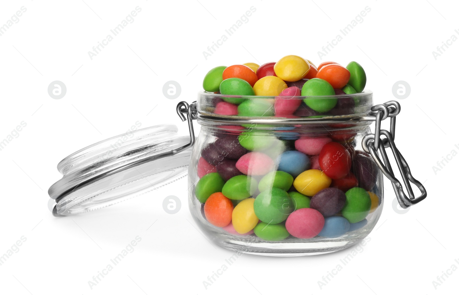 Photo of Many tasty candies in glass jar isolated on white