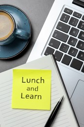 Image of Lunch and Learn concept. Laptop, planner, pen and cup of coffee on grey table, flat lay