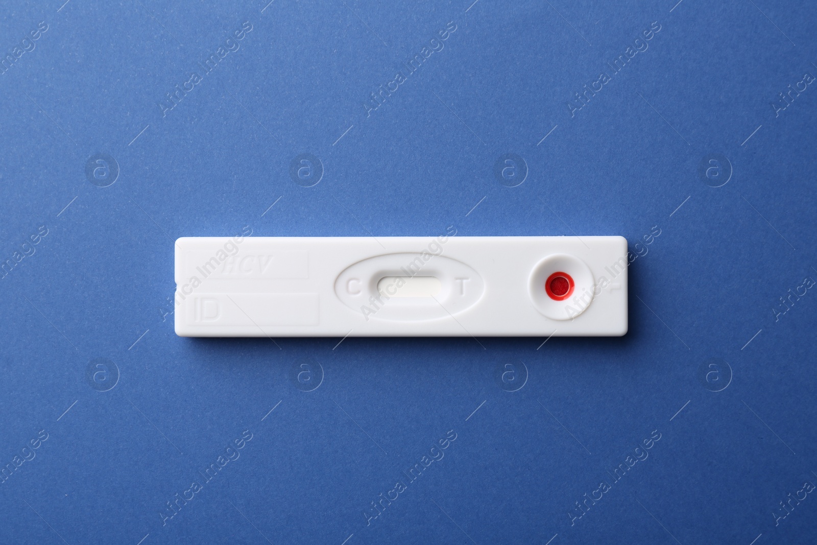 Photo of Disposable express test on blue background, top view