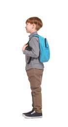 Little boy with backpack on white background