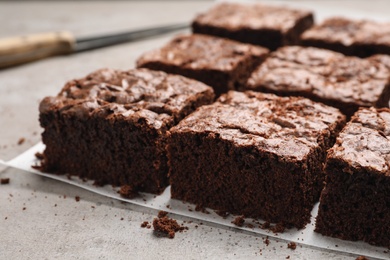 Photo of Fresh brownies on table. Delicious chocolate pie