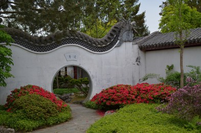 HAREN, NETHERLANDS - MAY 23, 2022: Beautiful view of Moon gate in Chinese garden