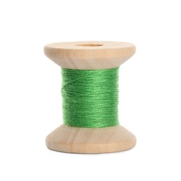 Photo of Wooden spool of light green sewing thread isolated on white