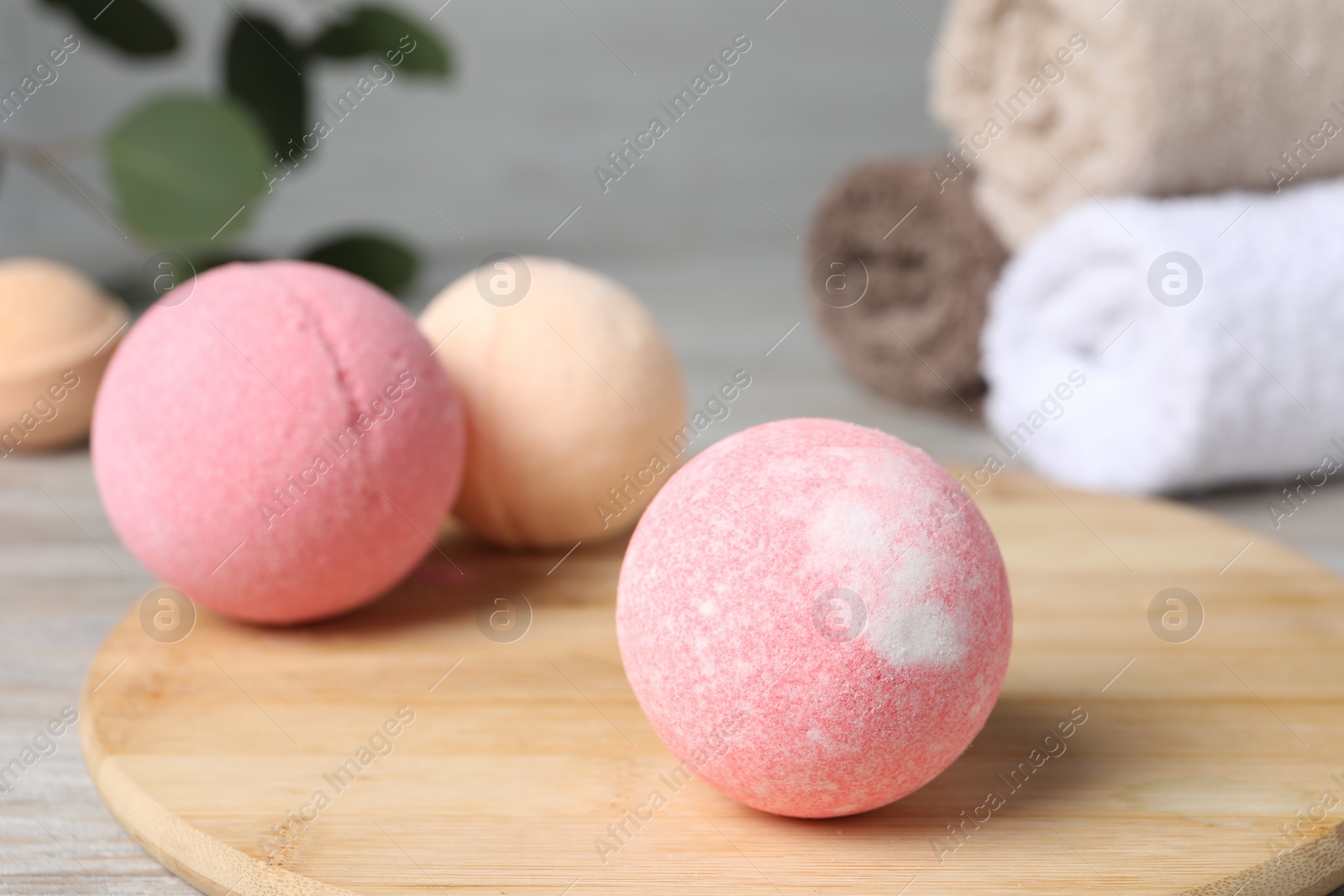 Photo of Beautiful aromatic bath bombs on table, closeup. Space for text