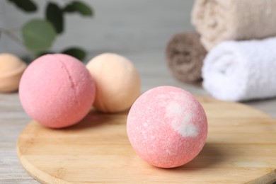 Photo of Beautiful aromatic bath bombs on table, closeup. Space for text