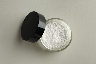 Photo of Rice loose face powder on light grey background, top view. Makeup product