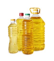 Photo of Bottles of cooking oil on white background