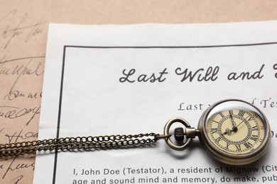 Last Will and Testament with pocket watch, closeup